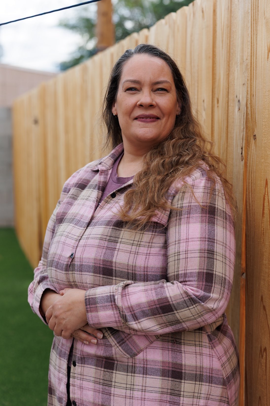 A woman smiles for the camera